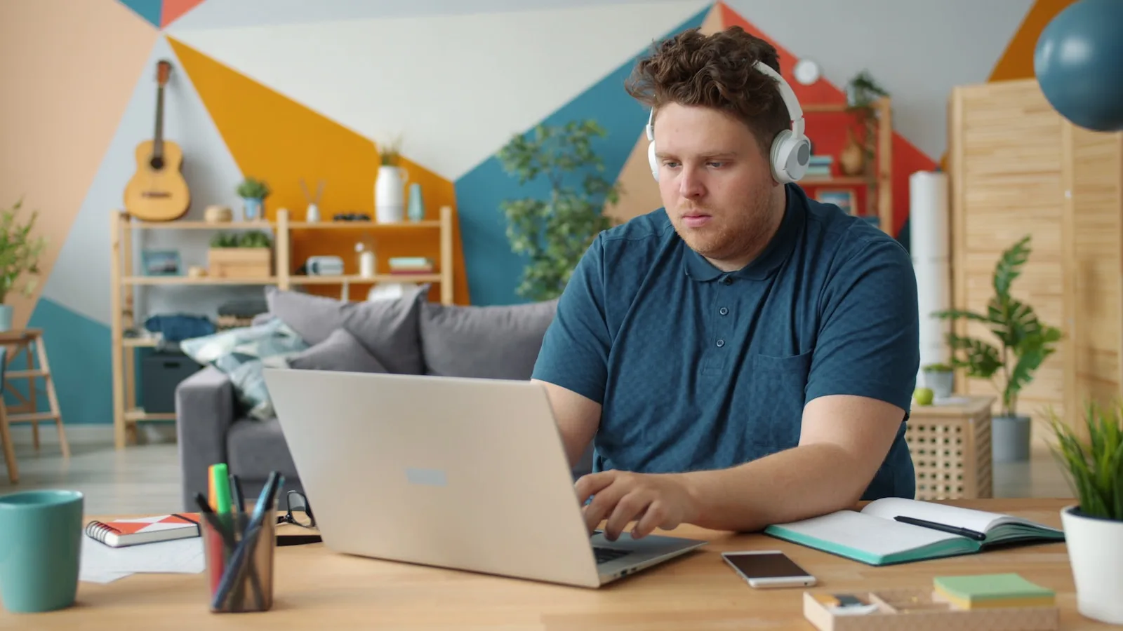 Someone working at a laptop in a home office