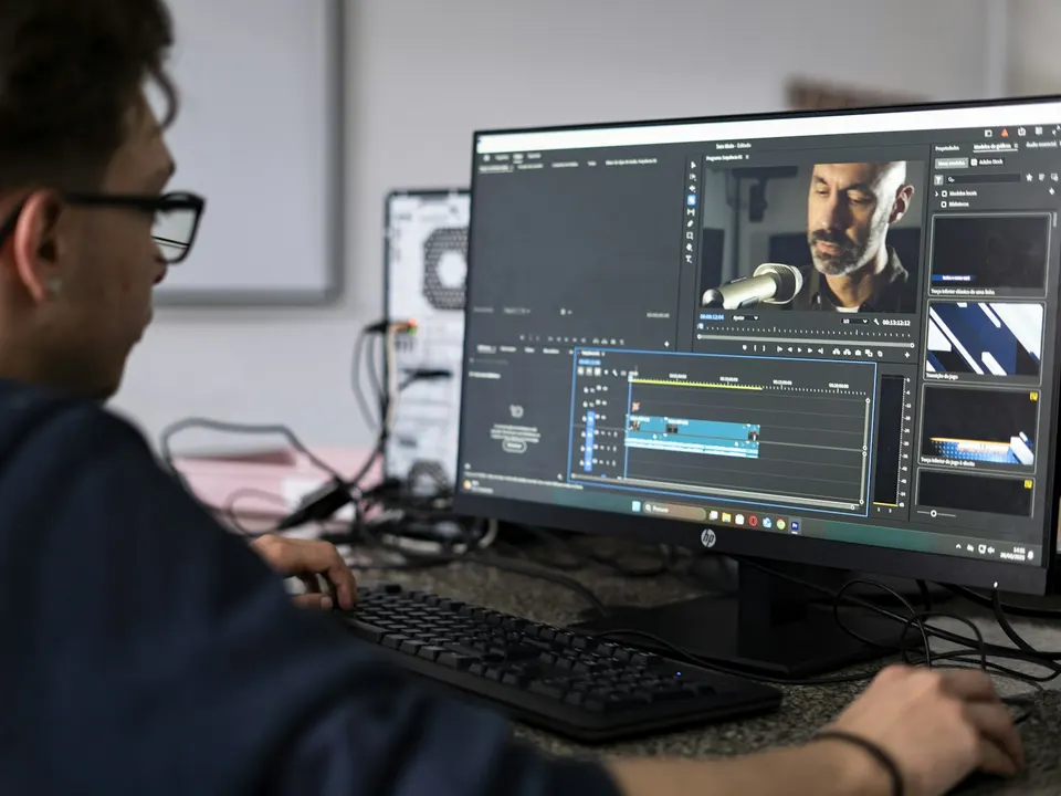 A videographer reviewing footage on location